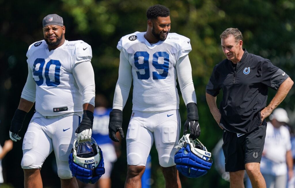 Colts DTs Deforest Buckner and Grover Stewart talking with DC Lou Anarumo