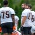 Cincinnati Bengals guard Dylan Fairchild (63) talks with offensive tackle Orlando Brown Jr. (75) during practice at the Paycor Stadium practice field in downtown Cincinnati on Wednesday, Aug. 20, 2025.