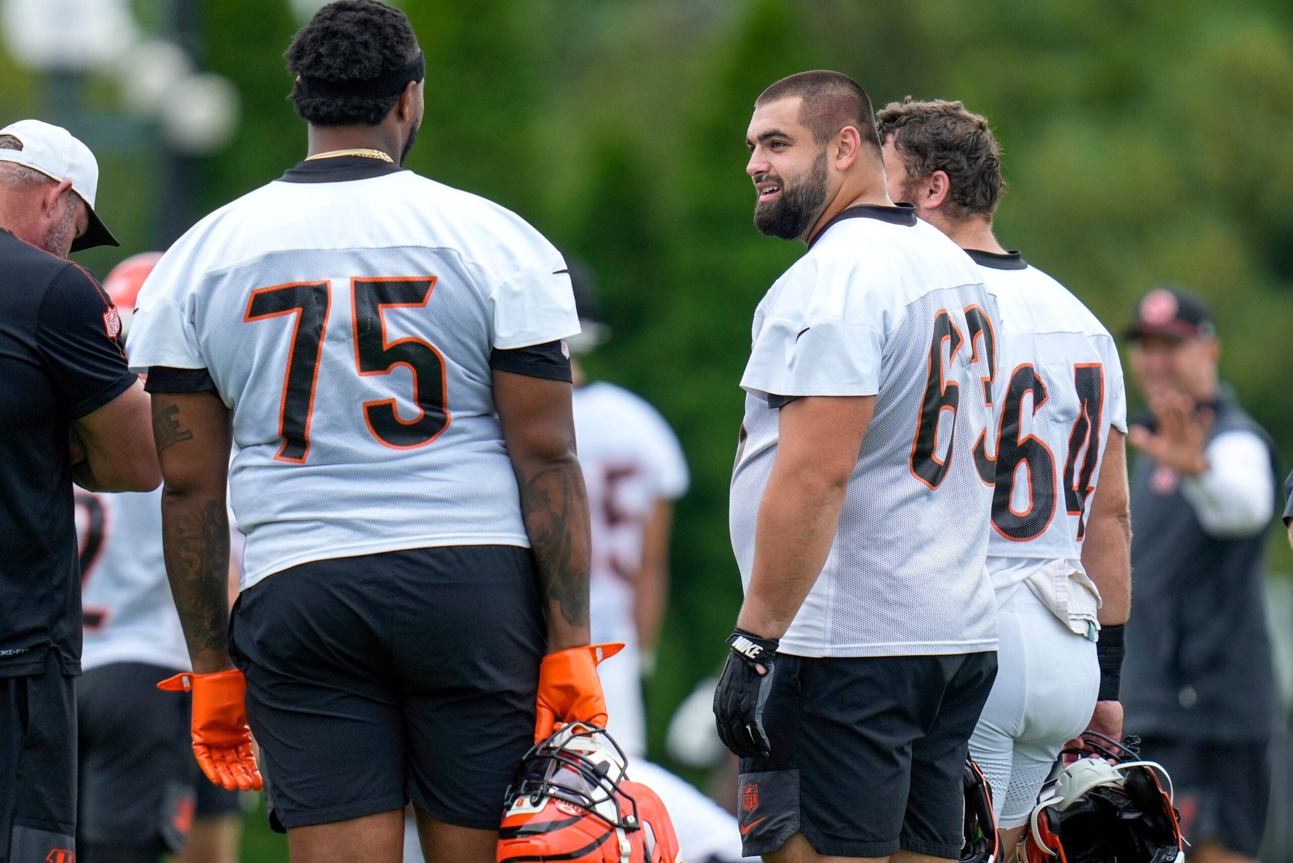 Cincinnati Bengals guard Dylan Fairchild (63) talks with offensive tackle Orlando Brown Jr. (75) during practice at the Paycor Stadium practice field in downtown Cincinnati on Wednesday, Aug. 20, 2025.