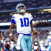 Aug 22, 2025; Arlington, Texas, USA; Dallas Cowboys quarterback Joe Milton III (10) reacts after scoring a touchdown during the first quarter against the Atlanta Falcons at AT&T Stadium.