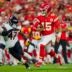 Aug 22, 2025; Kansas City, Missouri, USA; Kansas City Chiefs quarterback Patrick Mahomes (15) runs the ball against Chicago Bears linebacker Ruben Hyppolite II (47) during the first half at GEHA Field at Arrowhead Stadium.