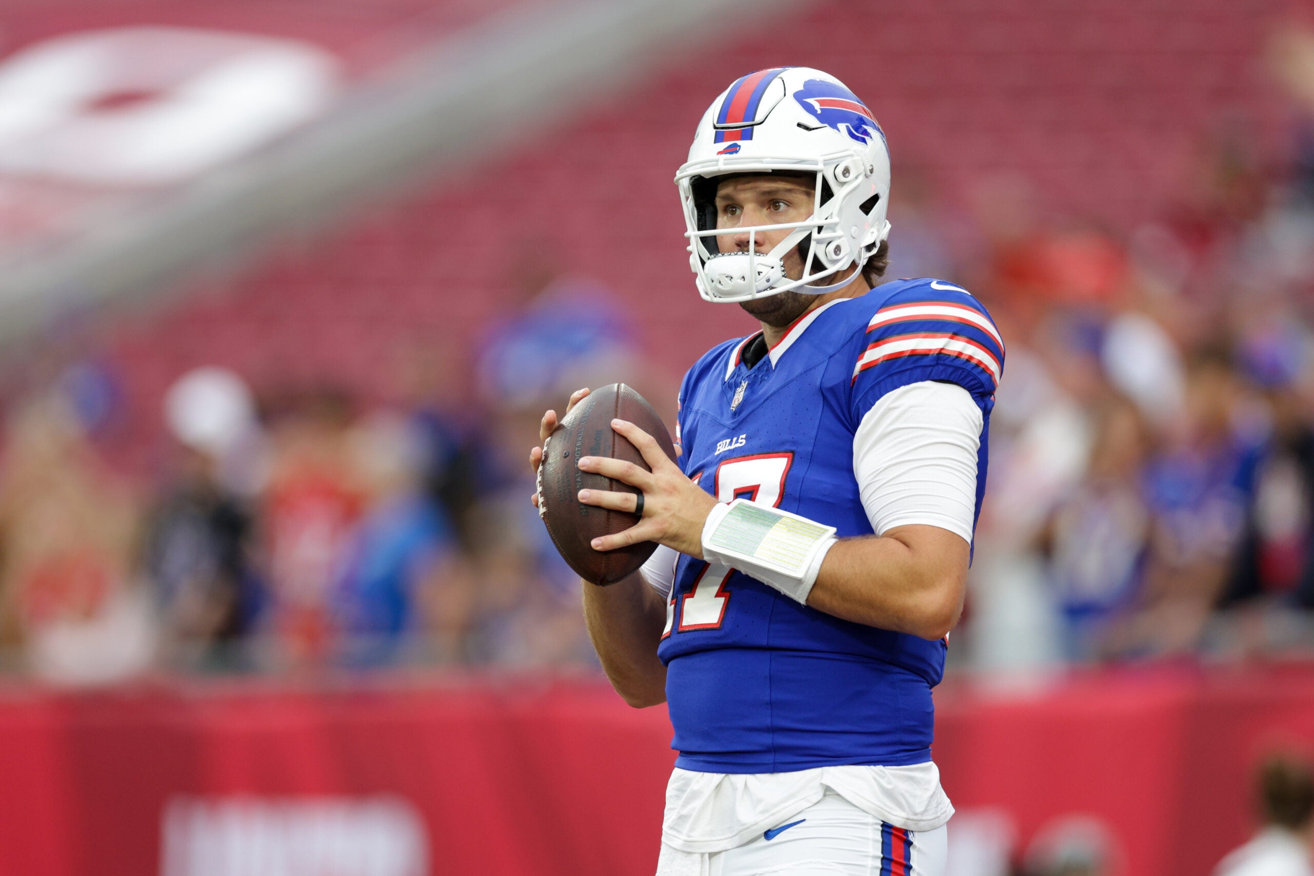 Aug 23, 2025; Tampa, Florida, USA; Buffalo Bills quarterback Josh Allen (17) warms up before a game against the Tampa Bay Buccaneers at Raymond James Stadium.