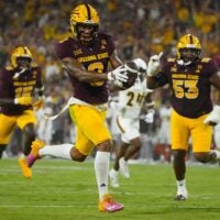 Arizona State wide receiver Jordyn Tyson (0) scores a touchdown against NAU during a game at Mountain America Stadium in Tempe on Aug. 30, 2025.