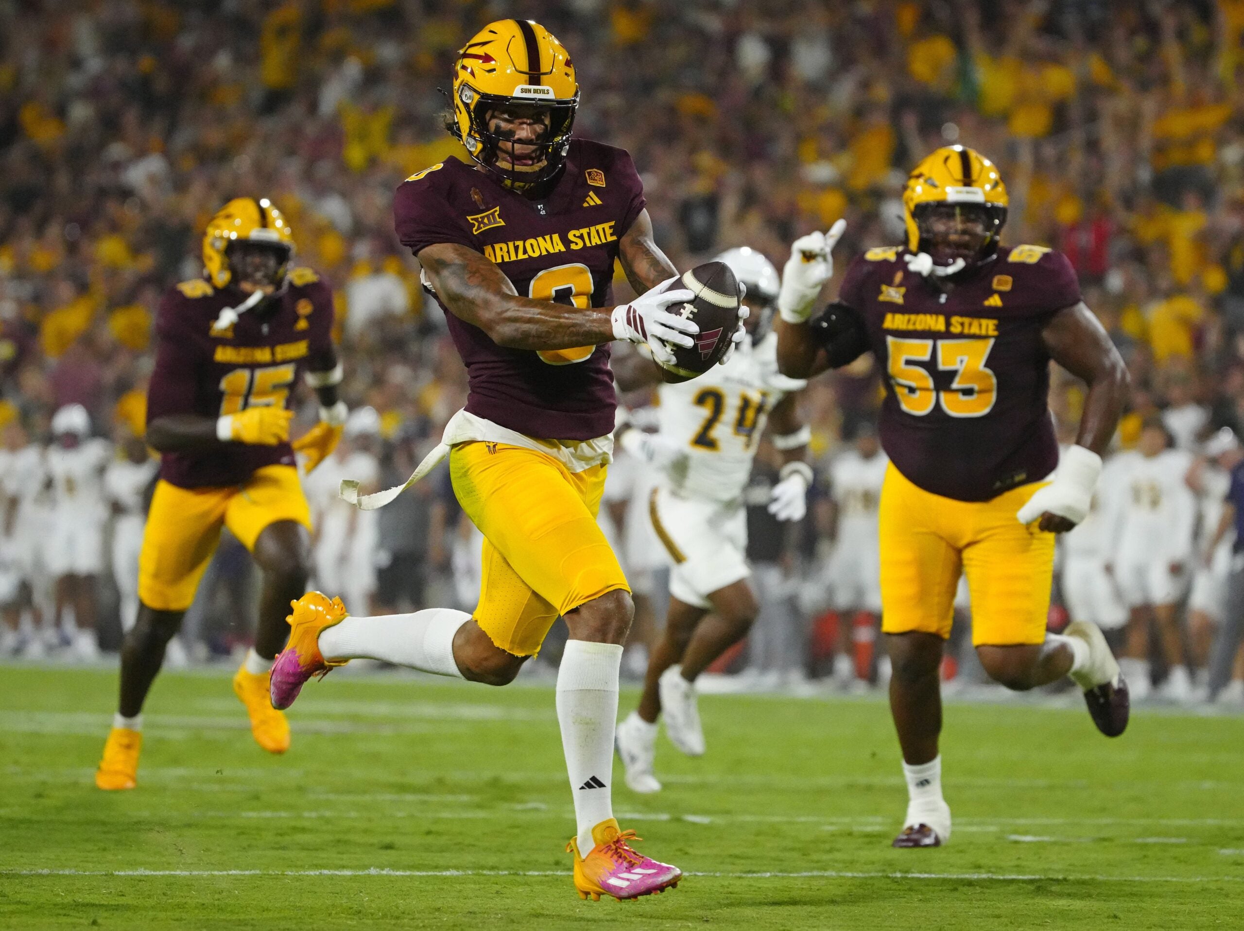 Arizona State wide receiver Jordyn Tyson (0) scores a touchdown against NAU during a game at Mountain America Stadium in Tempe on Aug. 30, 2025.
