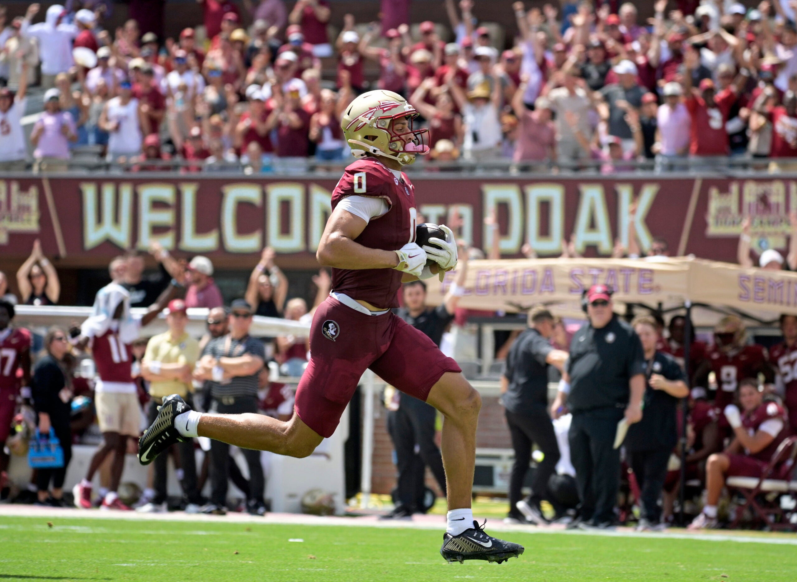 Sep 6, 2025; Tallahassee, Florida, USA; Florida State Seminoles wide receiver Duce Robinson (0) catches a touchdown during the first half against the East Texas A&M at Doak S. Campbell Stadium.