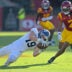 Sep 6, 2025; Los Angeles, California, USA; Georgia Southern Eagles wide receiver Josh Dallas (19) hangs on to the ball in front of USC Trojans safety Kamari Ramsey (7) for a first down during the first half at the Los Angeles Memorial Coliseum.