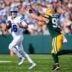 Detroit Lions quarterback Jared Goff (16) looks to pass against Green Bay Packers defensive end Lukas Van Ness (90) during the first half at Lambeau Field in Green Bay, Wis., on Sunday, September 7, 2025.