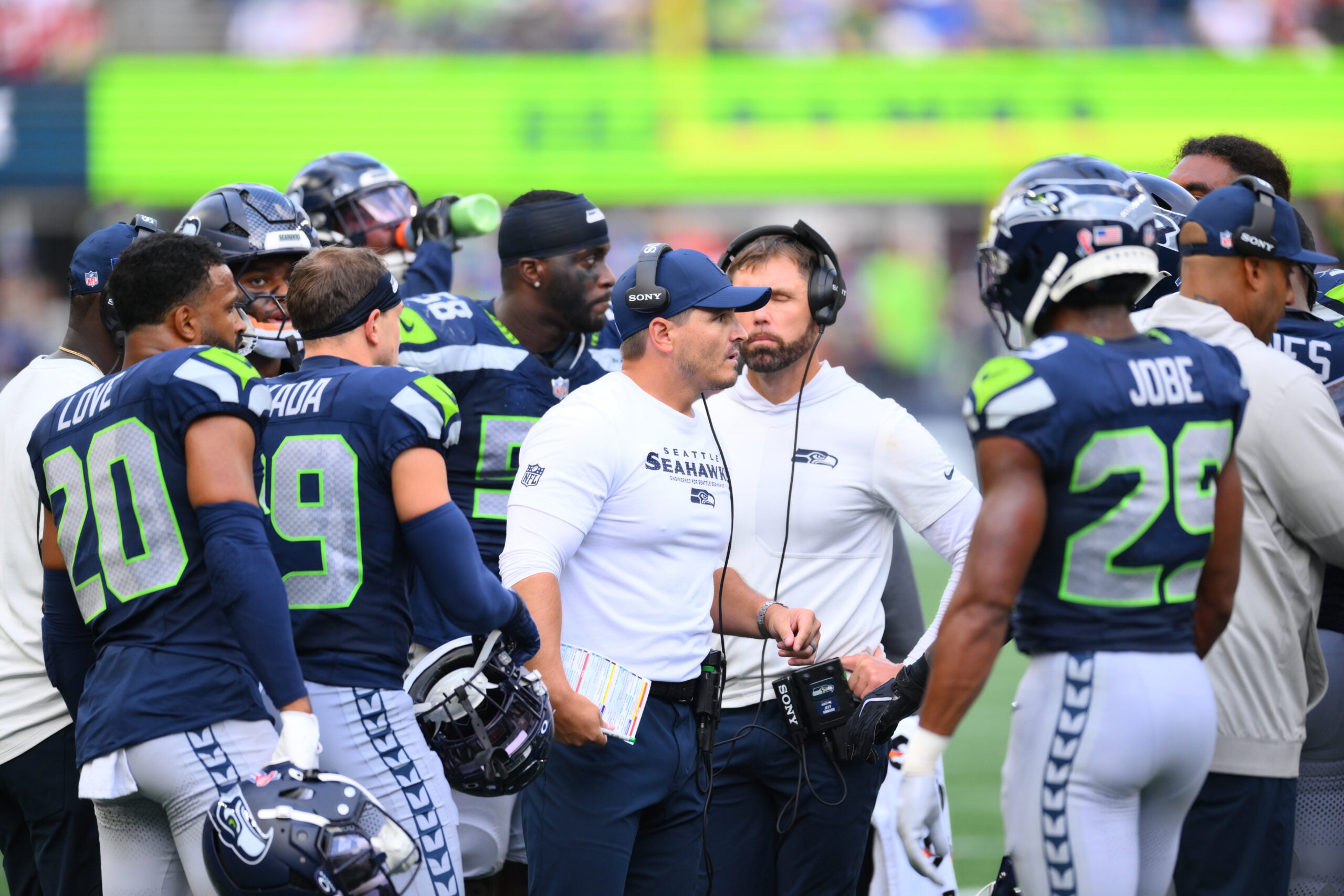 Seahawks head coach Mike MacDonald addresses team on the sideline