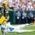 Detroit Lions cornerback D.J. Reed (4) tackles Green Bay Packers wide receiver Jayden Reed (11) during the second half at Lambeau Field in Green Bay, Wis., on Sunday, September 7, 2025.