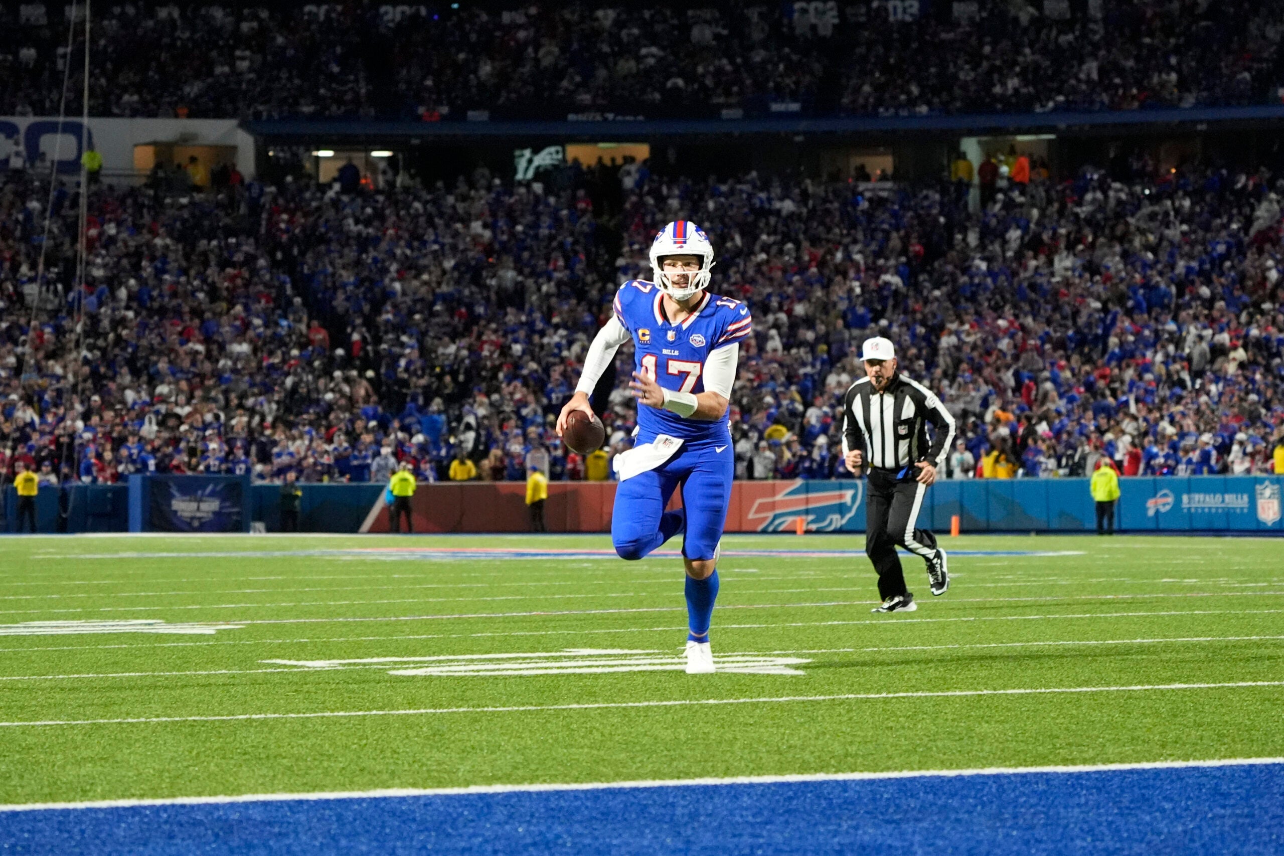 Sep 7, 2025; Orchard Park, New York, USA; Buffalo Bills quarterback Josh Allen (17) -rtb for a touchdown during the fourth quarter against the Baltimore Ravens at Highmark Stadium.