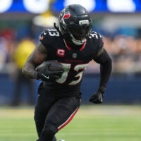 Sep 7, 2025; Inglewood, California, USA; Houston Texans running back Dare Ogunbowale (33) carries the ball against the Los Angeles Rams in the second half at SoFi Stadium.