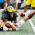 Sep 13, 2025; Ann Arbor, Michigan, USA; Central Michigan Chippewas quarterback Joe Labas (2) is sacked by Michigan Wolverines linebacker Jaishawn Barham (1) in the first half at Michigan Stadium.