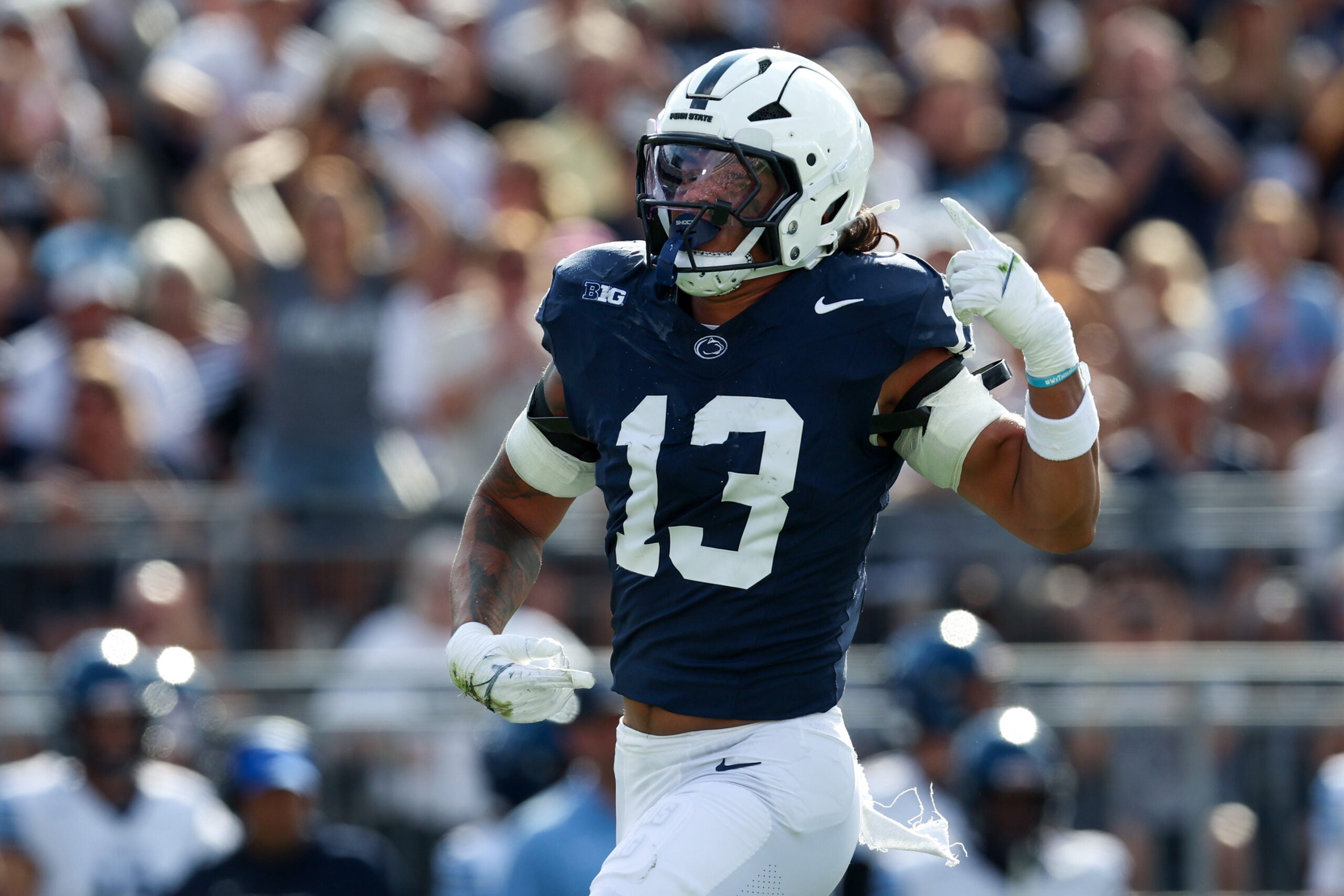 Sep 13, 2025; University Park, Pennsylvania, USA; Penn State Nittany Lions linebacker Tony Rojas (13) reacts following a sack on Villanova Wildcats quarterback Tanner Maddocks (3) during the second quarter at Beaver Stadium.