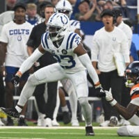 Sep 14, 2025; Indianapolis, Indiana, USA; Indianapolis Colts cornerback Kenny Moore II (23) celebrates tackling Denver Broncos wide receiver Troy Franklin (11) during the second quarter at Lucas Oil Stadium.