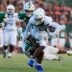 IMG Academy's Osani Gayles (13) rushes for yards against Mandarin's Tamajh Mitchell (7) during the first quarter of a high school football matchup at Mandarin High School, Friday, Sept. 19, 2025, in Jacksonville, Fla. The IMG Academy Ascenders defeated the Mandarin Mustangs 57-7.