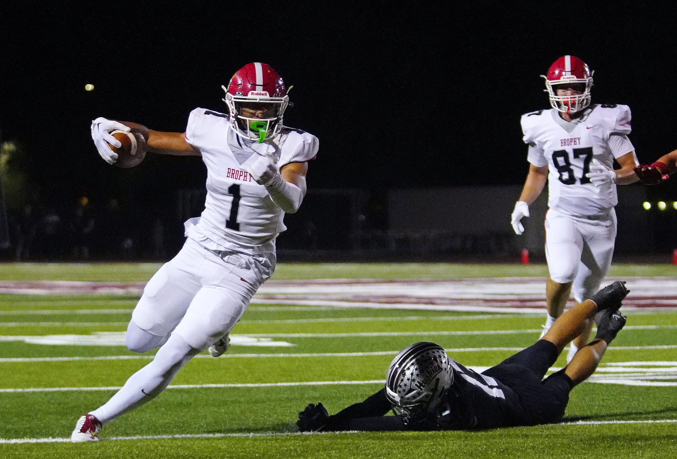 Brophy wide receiver Devin Fitzgerald (1) breaks a Hamilton tackle for a first down during a game at Hamilton High School in Chandler, on Sept. 19, 2025.