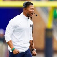 Notre Dame head coach Marcus Freeman celebrates after an interception by cornerback Christian Gray during the first half of a NCAA football game against Purdue at Notre Dame Stadium on Saturday, Sept. 20, 2025, in South Bend.