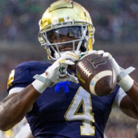 Sep 20, 2025; South Bend, Indiana, USA; Notre Dame Fighting Irish running back Jeremiyah Love (4) celebrates scoring against the Purdue Boilermakers in the second half at Notre Dame Stadium.