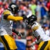 Sep 21, 2025; Foxborough, Massachusetts, USA; Pittsburgh Steelers running back Kenneth Gainwell (14) and Pittsburgh Steelers offensive tackle Broderick Jones (77) react after a touchdown during the first quarter at Gillette Stadium.
