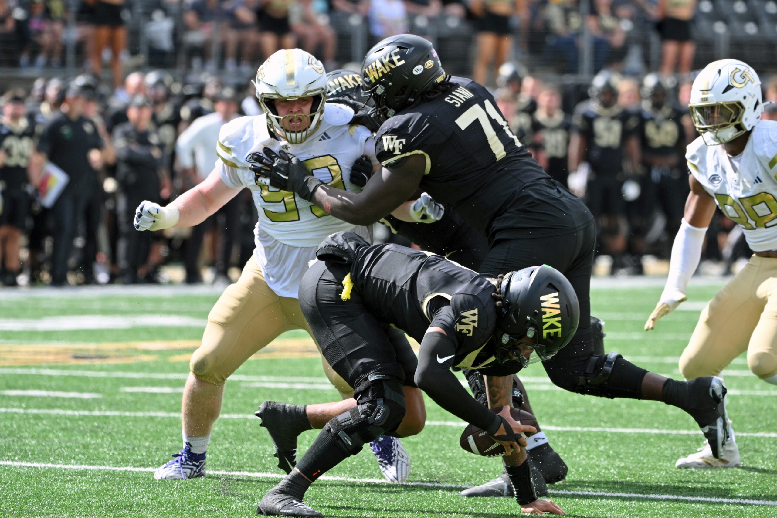 Sep 27, 2025; Winston-Salem, North Carolina, USA; Wake Forest Demon Deacons offensive lineman Melvin Siani (71) blocks Georgia Tech Yellow Jackets defensive lineman Jordan van den Berg (99) during the fourth quarter at Allegacy Federal Credit Union Stadium.