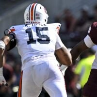 Sep 27, 2025; College Station, Texas, USA; Texas A&M Aggies offensive lineman Jonte Newman (75) blocks against Auburn Tigers defensive end Keldric Faulk (15) at Kyle Field.