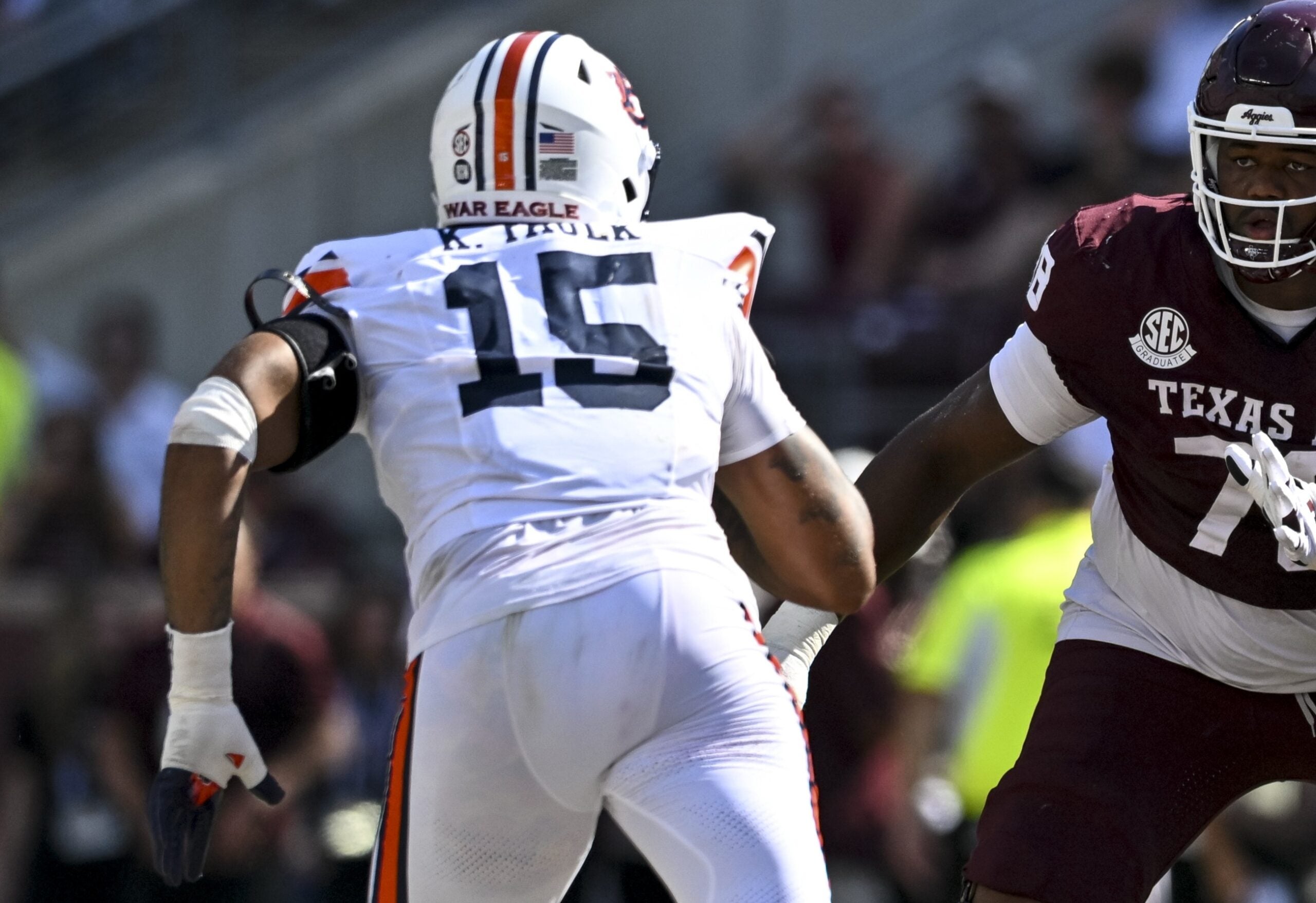 Sep 27, 2025; College Station, Texas, USA; Texas A&M Aggies offensive lineman Jonte Newman (75) blocks against Auburn Tigers defensive end Keldric Faulk (15) at Kyle Field.