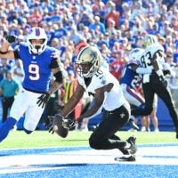 Sep 28, 2025; Orchard Park, New York, USA; New Orleans Saints wide receiver Brandin Cooks (10) drops a pass in the end zone under pressure from Buffalo Bills safety Taylor Rapp (9) during the fourth quarter at Highmark Stadium.