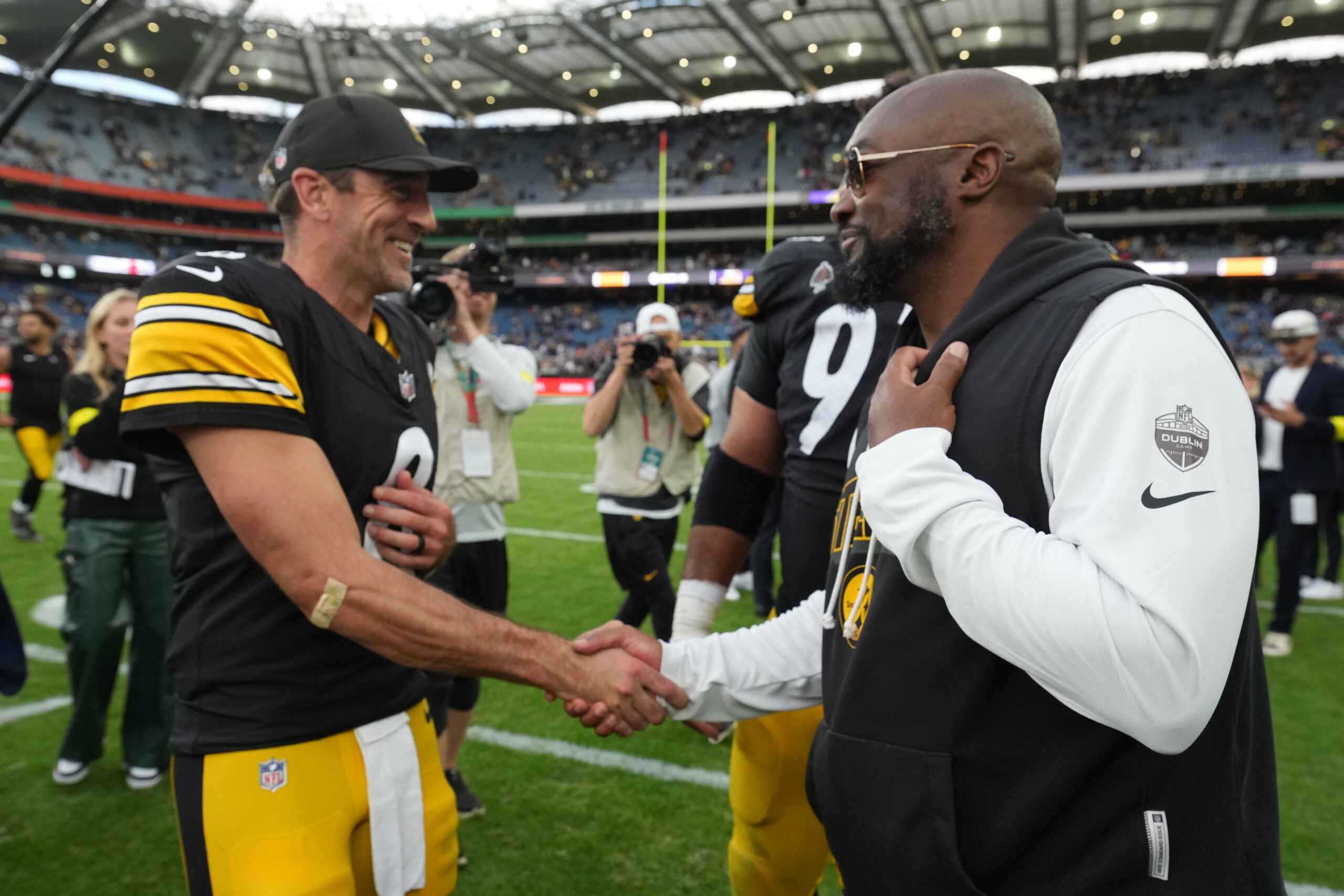 Sep 28, 2025; Dublin, Ireland; Pittsburgh Steelers quarterback Aaron Rodgers (8) and coach Mike Tomlin shake hands after an NFL International Series game against the Minnesota Vikings at Croke Park.