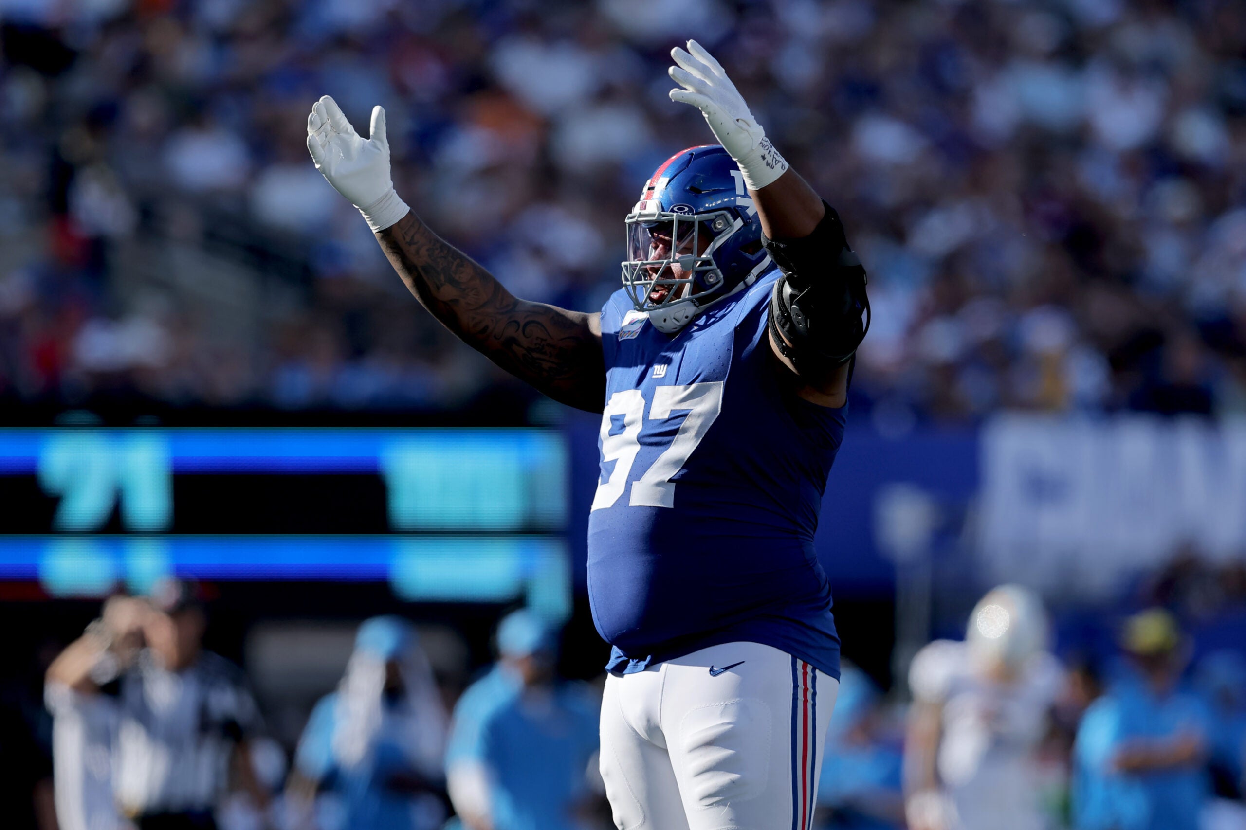 Sep 28, 2025; East Rutherford, New Jersey, USA; New York Giants defensive tackle Dexter Lawrence (97) reacts during the fourth quarter against the Los Angeles Chargers at MetLife Stadium.