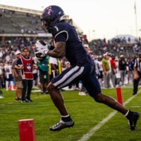 Oct 4, 2025; East Hartford, Connecticut, USA; UConn Huskies wide receiver Skyler Bell (1) makes the touchdown catch against the FIU Panthers in the third quarter at Pratt & Whitney Stadium at Rentschler Field.