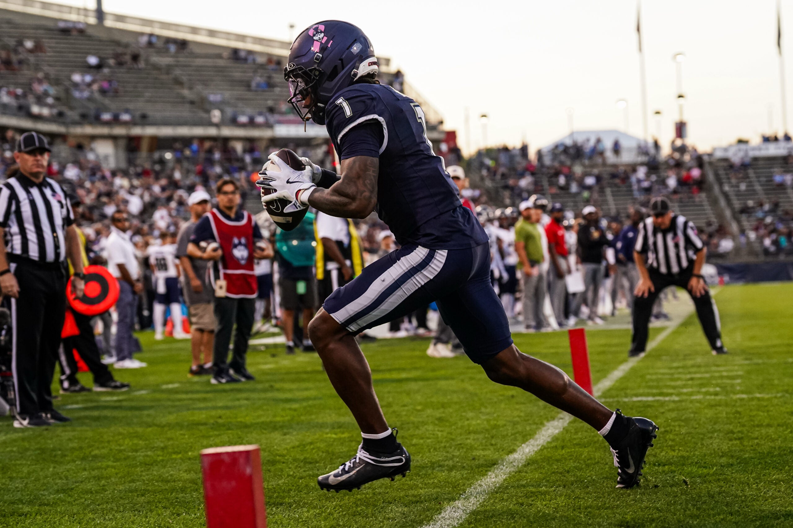 Oct 4, 2025; East Hartford, Connecticut, USA; UConn Huskies wide receiver Skyler Bell (1) makes the touchdown catch against the FIU Panthers in the third quarter at Pratt & Whitney Stadium at Rentschler Field.