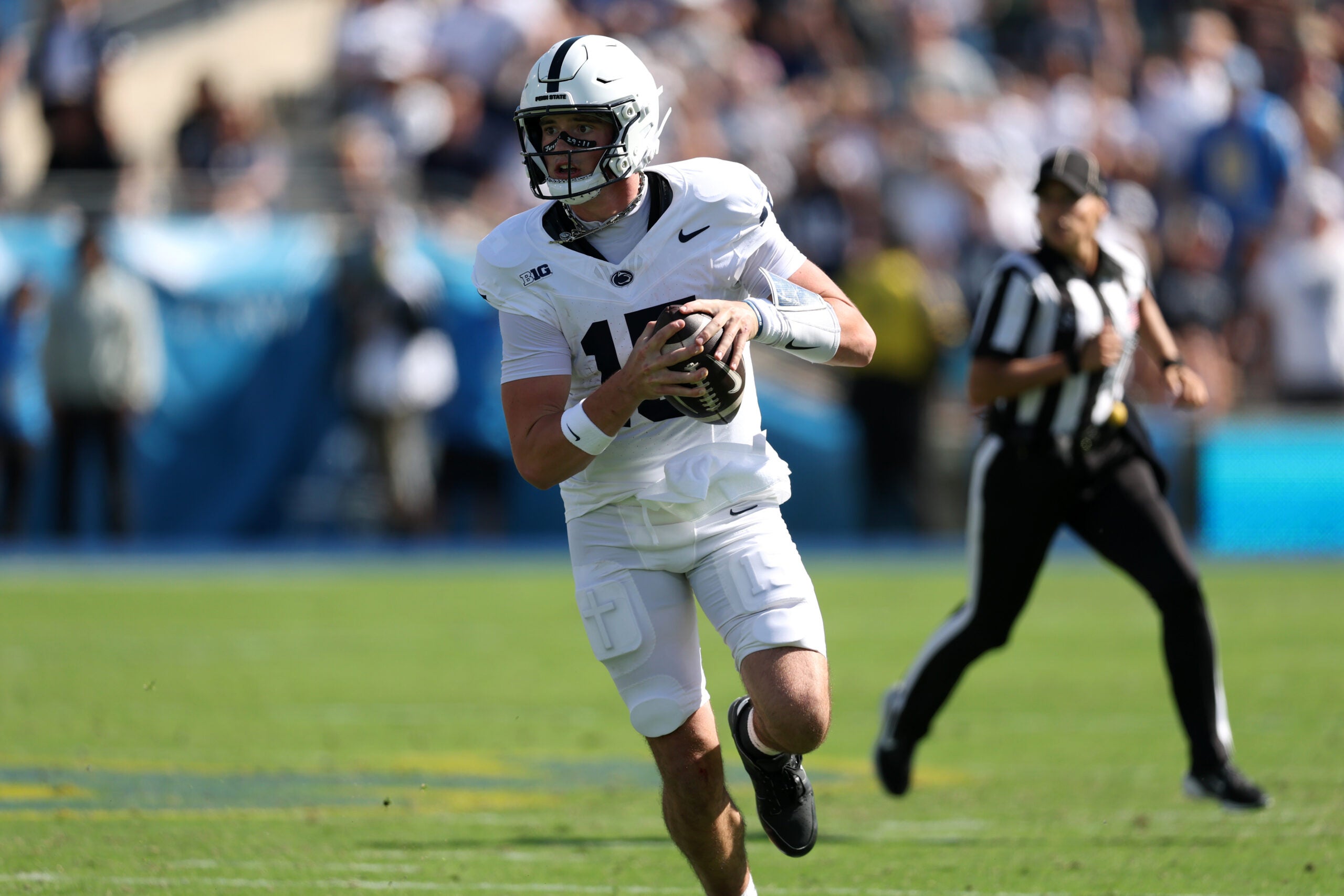 Oct 4, 2025; Pasadena, California, USA; Penn State Nittany Lions quarterback Drew Allar (15) runs with the ball during the third quarter against the UCLA Bruins at Rose Bowl.