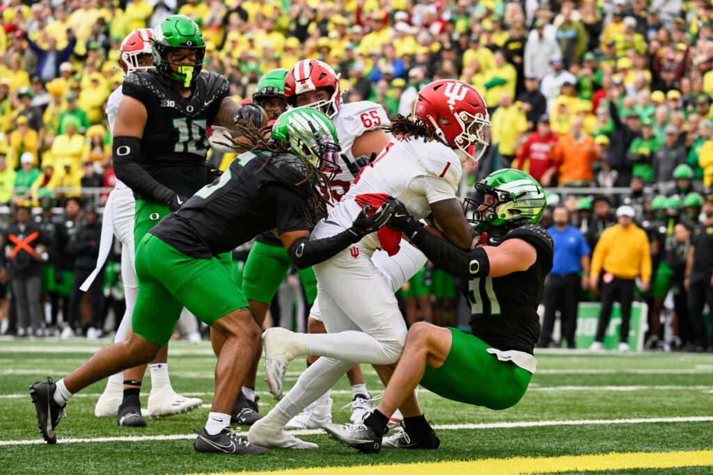 Oct 11, 2025; Eugene, Oregon, USA; Indiana Hoosiers running back Roman Hemby (1) runs for a touchdown against Oregon Ducks defensive back Dillon Thieneman (31) during the first quarter at Autzen Stadium. 