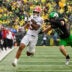 Oct 11, 2025; Eugene, Oregon, USA; Indiana Hoosiers wide receiver Elijah Sarratt (13) runs with the ball after making a catch against Oregon Ducks defensive back Dillon Thieneman (31) during the fourth quarter at Autzen Stadium.