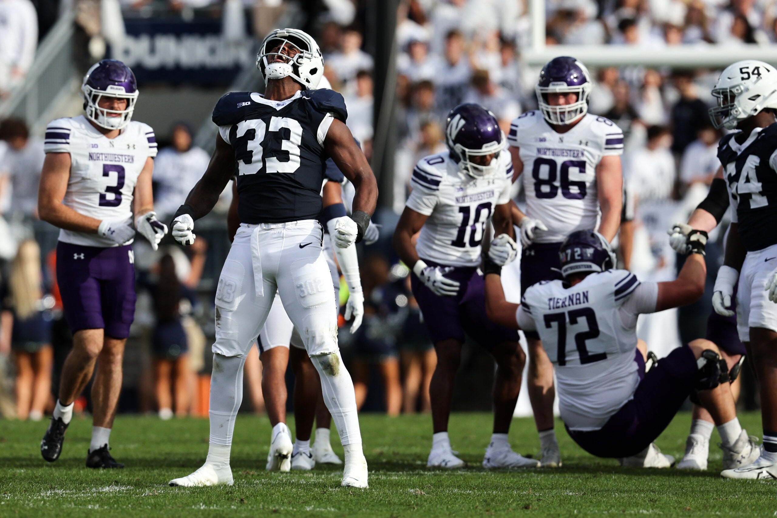 Oct 11, 2025; University Park, Pennsylvania, USA; Penn State Nittany Lions defensive end Dani Dennis-Sutton (33) reacts following a tackle during the second quarter against the Northwestern Wildcats at Beaver Stadium.