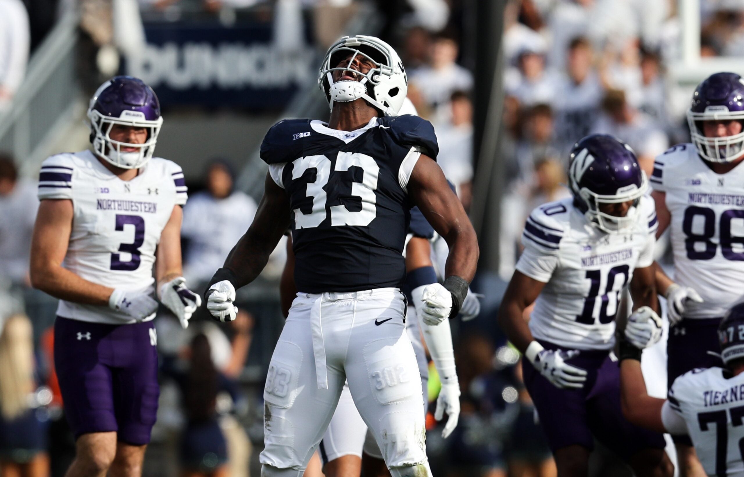 Oct 11, 2025; University Park, Pennsylvania, USA; Penn State Nittany Lions defensive end Dani Dennis-Sutton (33) reacts following a tackle during the second quarter against the Northwestern Wildcats at Beaver Stadium.