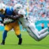 Oct 12, 2025; Miami Gardens, Florida, USA; Miami Dolphins linebacker Jordyn Brooks (20) tackles Los Angeles Chargers running back Kimani Vidal (30) during the third quarter at Hard Rock Stadium.