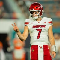 Oct 17, 2025; Miami Gardens, Florida, USA; Louisville Cardinals quarterback Miller Moss (7) reacts on the field against the Miami Hurricanes during the second quarter at Hard Rock Stadium.