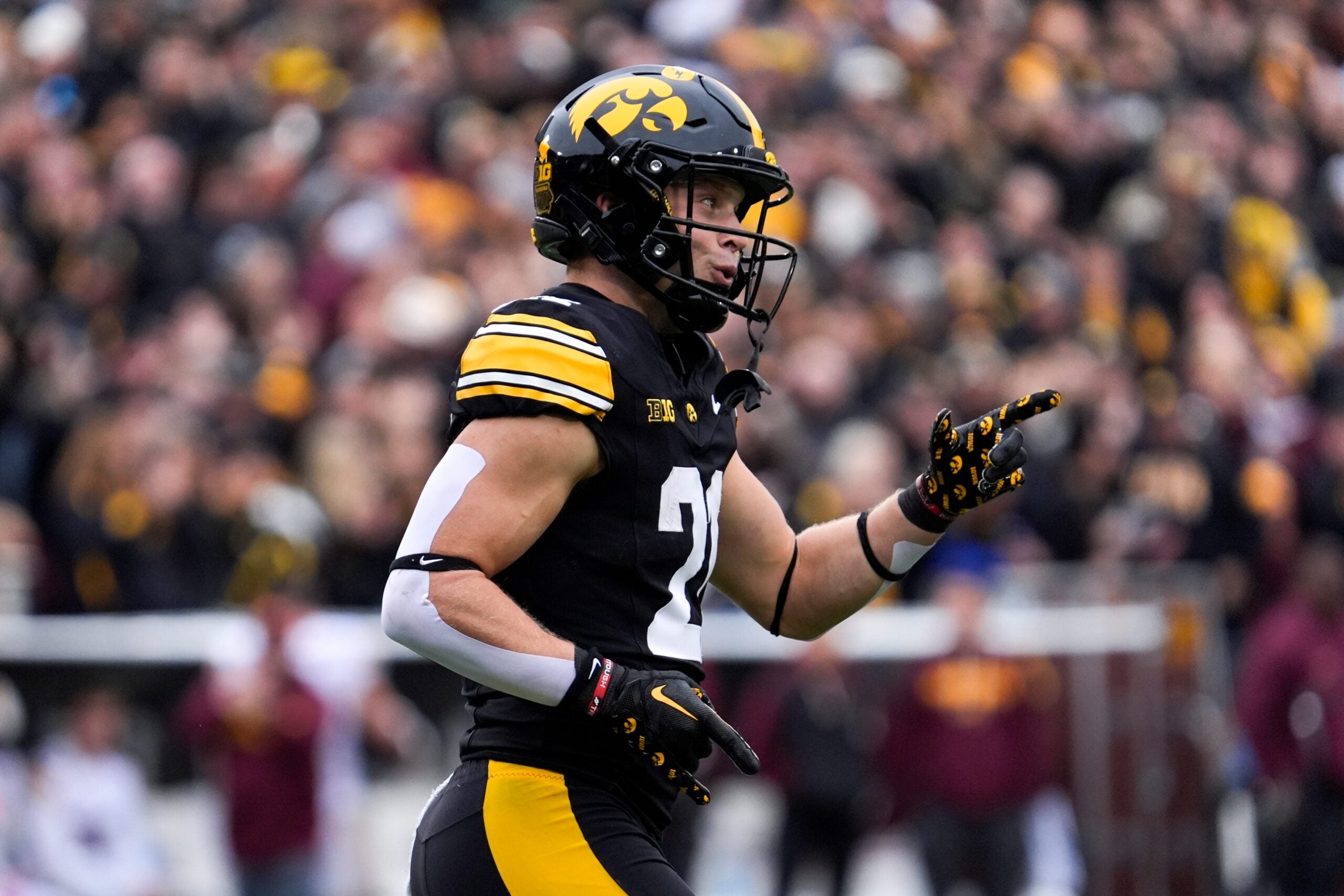 Iowa Hawkeyes wide receiver Kaden Wetjen (21) reacts after returning a punt for a touchdown against the Minnesota Golden Gophers Oct. 25, 2025 at Kinnick Stadium in Iowa City, Iowa.