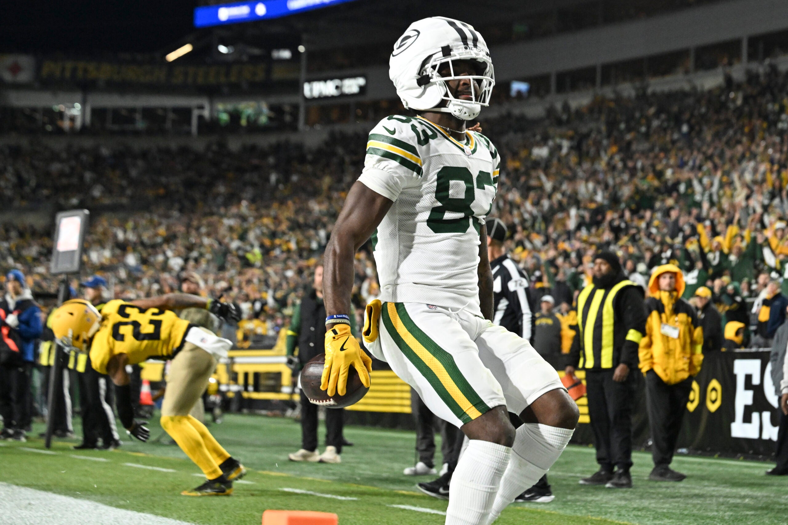 Oct 26, 2025; Pittsburgh, Pennsylvania, USA; Green Bay Packers wide receiver Savion Williams (83) scores a touchdown against the Pittsburgh Steelers during the third quarter at Acrisure Stadium.