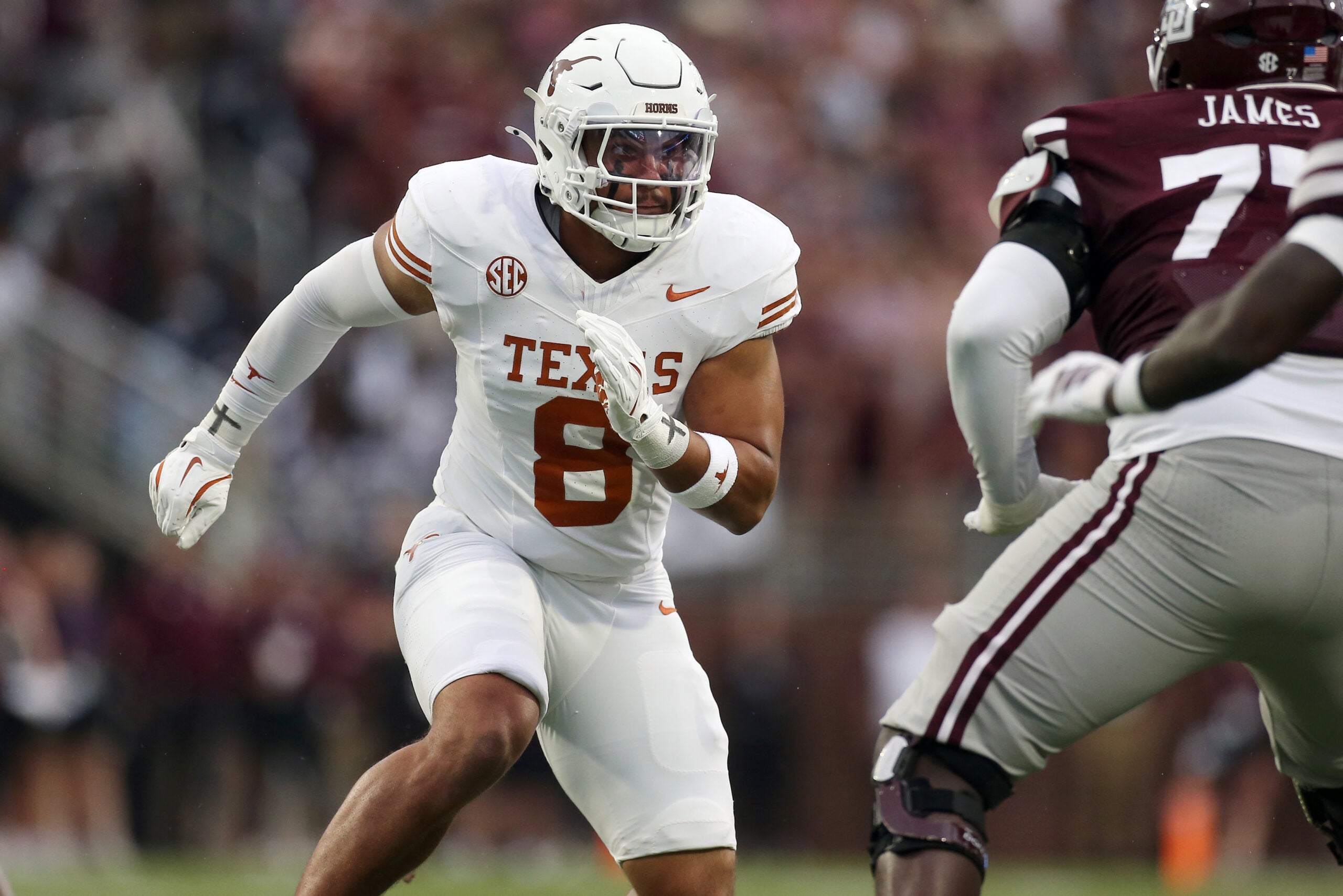 Oct 25, 2025; Starkville, Mississippi, USA; Texas Longhorns linebacker Trey Moore (8) attempts to get into the backfield during the second quarter against the Mississippi State Bulldogs at Davis Wade Stadium at Scott Field.