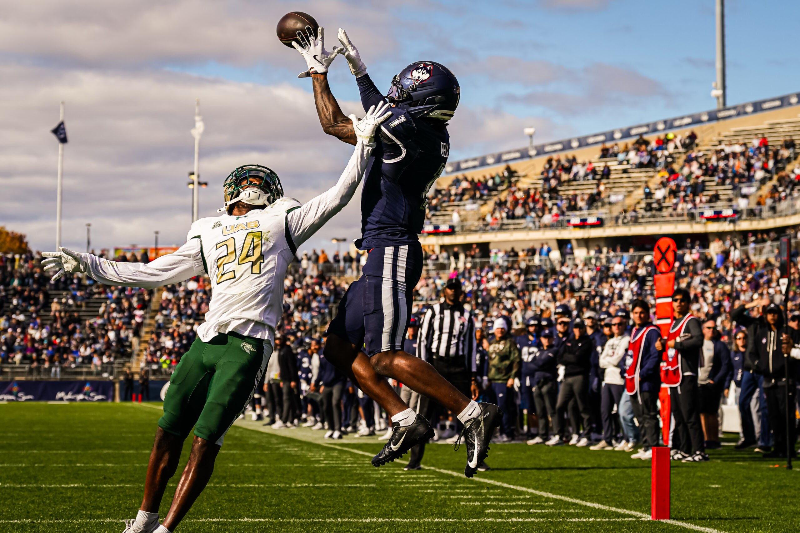 Nov 1, 2025; East Hartford, Connecticut, USA; UConn Huskies wide receiver Skyler Bell (1) makes the touchdown against UAB Blazers cornerback Tariq Watson (24) in the second quarter at Pratt & Whitney Stadium at Rentschler Field.