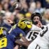 Michigan defensive end Derrick Moore (8) forces Purdue quarterback Ryan Browne (15) to fumble during the first half at Michigan Stadium in Ann Arbor on Saturday, November 1, 2025.