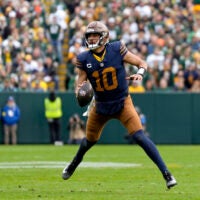 Nov 2, 2025; Green Bay, Wisconsin, USA; Green Bay Packers quarterback Jordan Love (10) scrambles during the second half against the Carolina Panthers at Lambeau Field.
