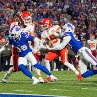 Nov 2, 2025; Orchard Park, New York, USA; Kansas City Chiefs quarterback Patrick Mahomes (15) is sacked by Buffalo Bills defensive end Greg Rousseau (50) in the second half at Highmark Stadium.