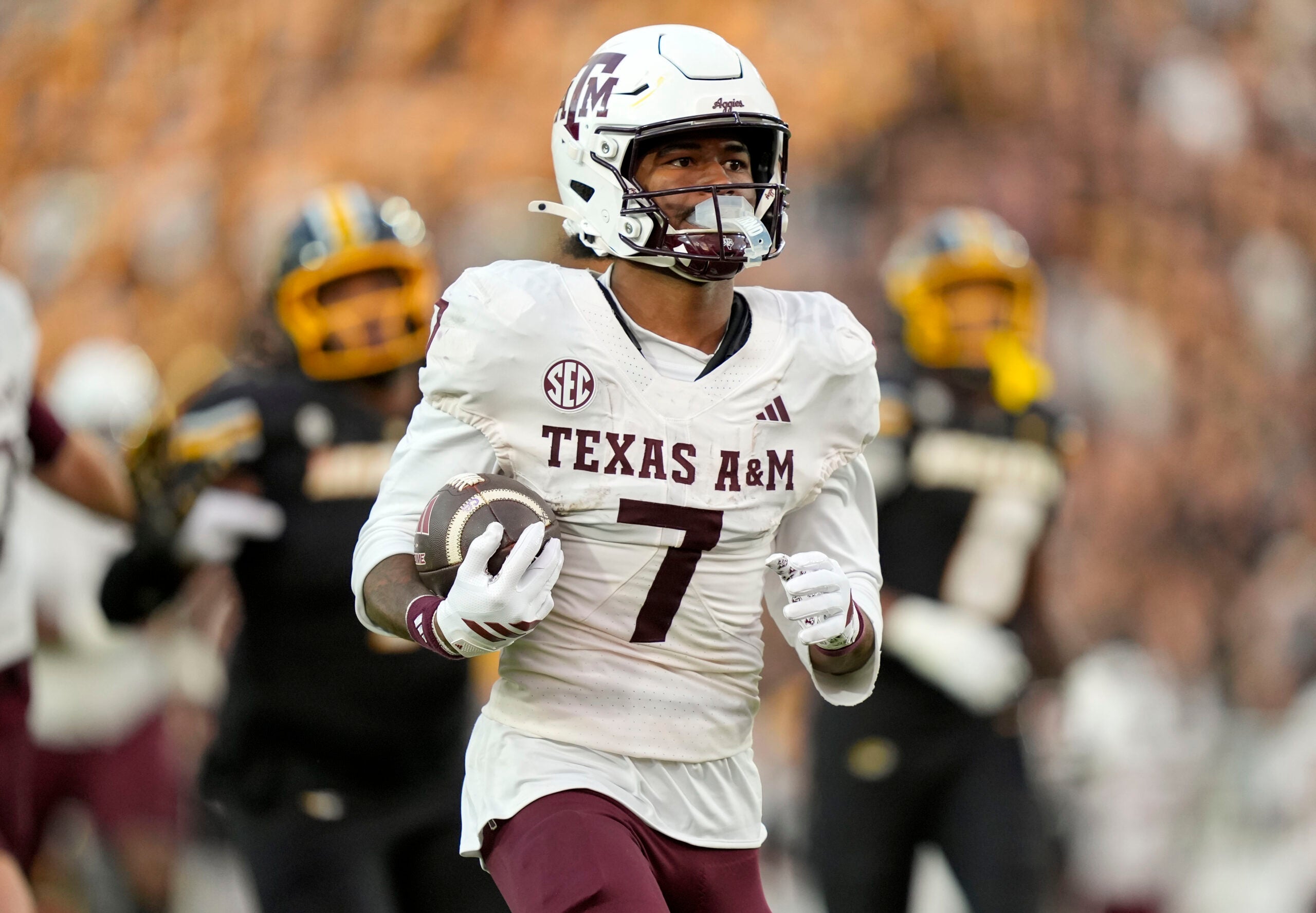 Nov 8, 2025; Columbia, Missouri, USA; Texas A&M Aggies wide receiver KC Concepcion (7) runs for a touchdown during the second half against the Missouri Tigers at Faurot Field at Memorial Stadium.