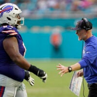 Nov 9, 2025; Miami Gardens, Florida, USA; Buffalo Bills head coach Sean McDermott congratulates guard O'Cyrus Torrence (64) after a play during the second half against the Miami Dolphins at Hard Rock Stadium.