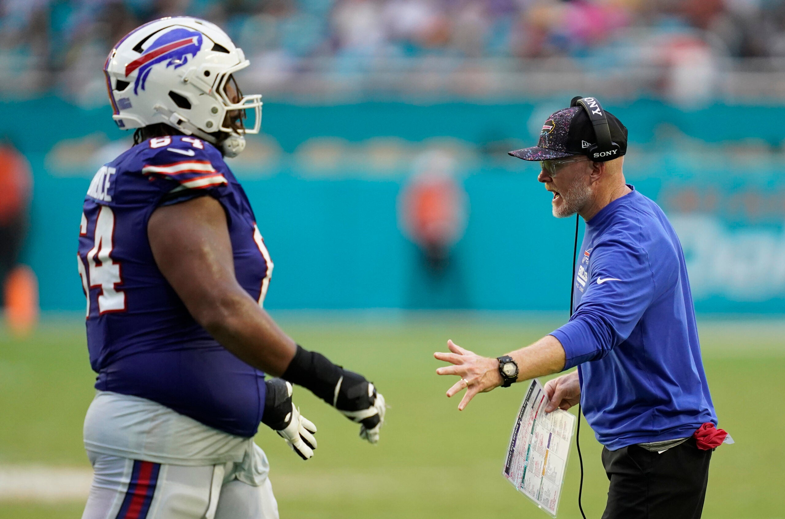 Nov 9, 2025; Miami Gardens, Florida, USA; Buffalo Bills head coach Sean McDermott congratulates guard O'Cyrus Torrence (64) after a play during the second half against the Miami Dolphins at Hard Rock Stadium.
