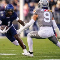 Nov 15, 2025; East Hartford, Connecticut, USA; UConn Huskies wide receiver Skyler Bell (1) runs the ball against the Air Force Falcons in the second half at Pratt & Whitney Stadium at Rentschler Field.
