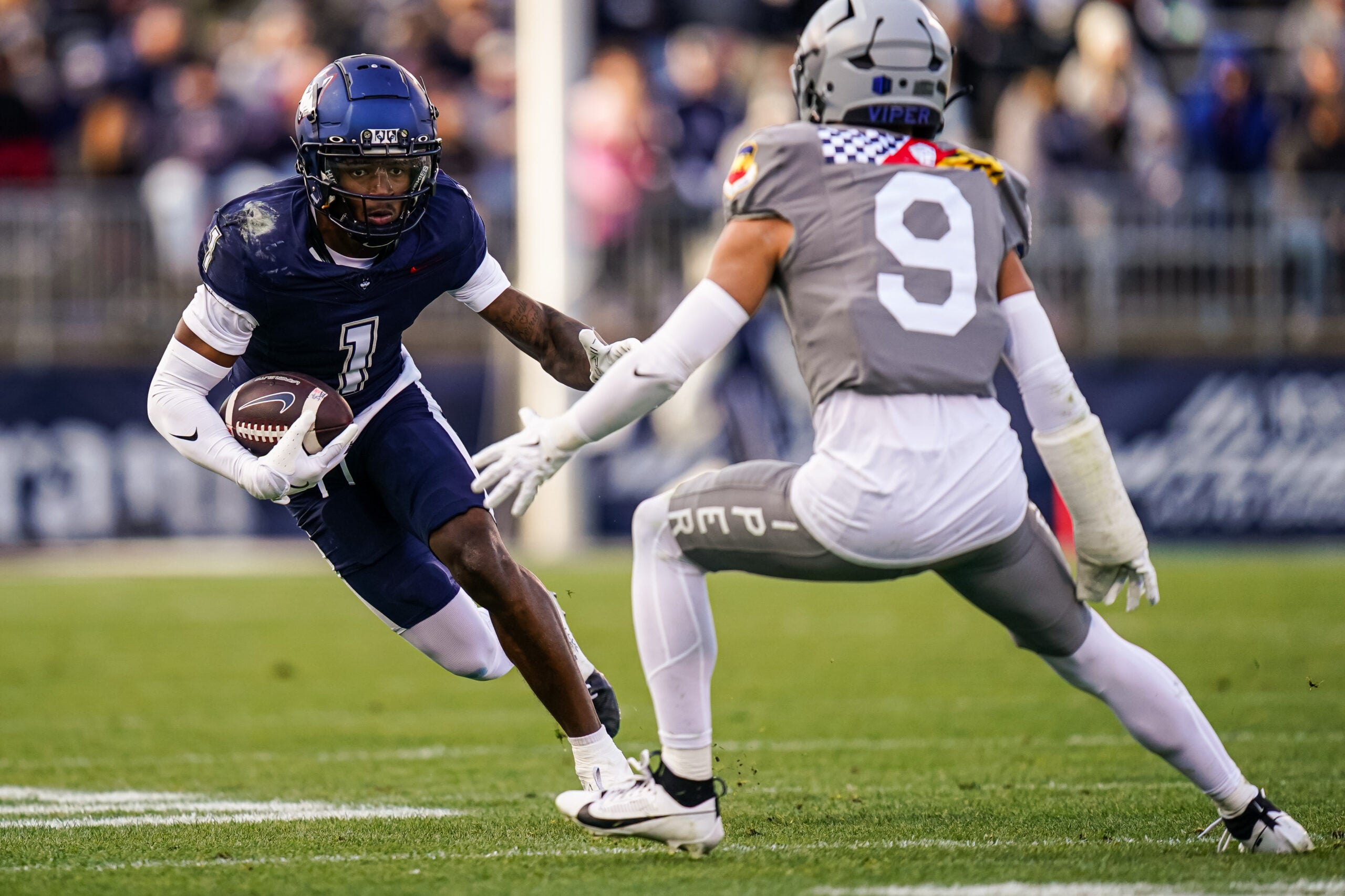 Nov 15, 2025; East Hartford, Connecticut, USA; UConn Huskies wide receiver Skyler Bell (1) runs the ball against the Air Force Falcons in the second half at Pratt & Whitney Stadium at Rentschler Field.